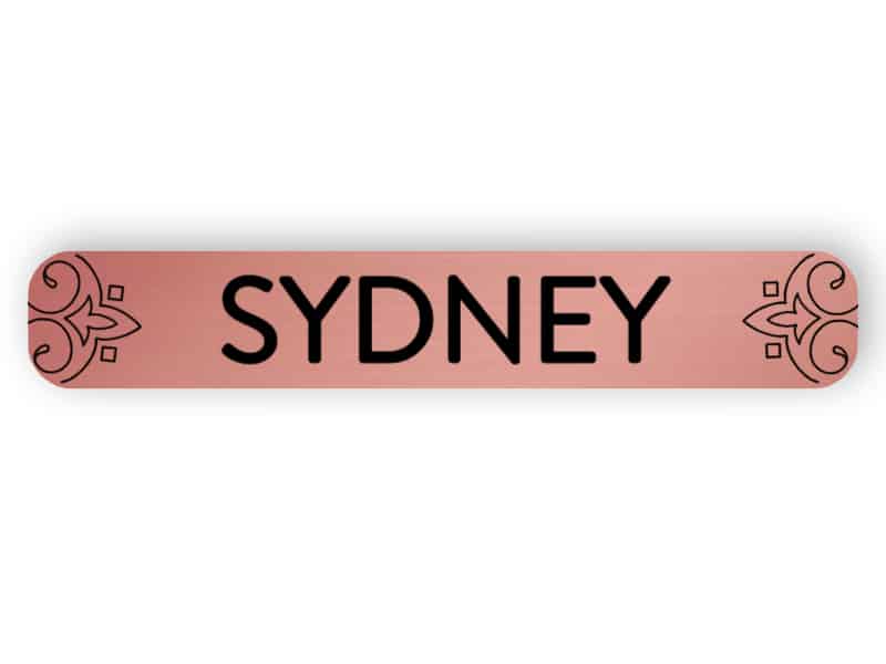 Sydney - rose guld märke